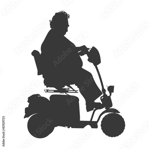 Silhouette of woman on mobility scooter.