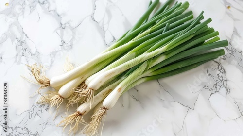 green onions with a minimalist composition  featuring a bunch of verdant stalks elegantly arranged against a pristine white background  highlighting the natural beauty of this versatile ingredient.