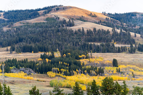 Sunset in the Lamar Valley in Yellowstone National Park in Montana and Wyoming on a beautiful fall evening. Sun sets over the mountains and sagebrush with a colorful sky illuminating the landscape.
