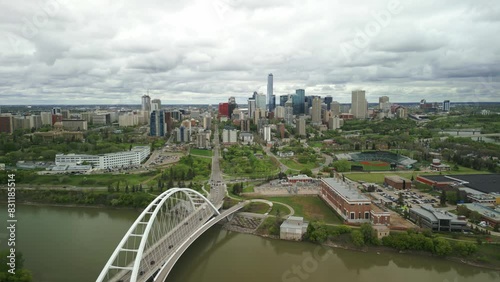 Edmonton downtown skyline with perspective over the Queen Elizabeth II Park, with the Walterdale Bridge featured. The vibrant cityscape, nestled along the North Saskatchewan River. photo