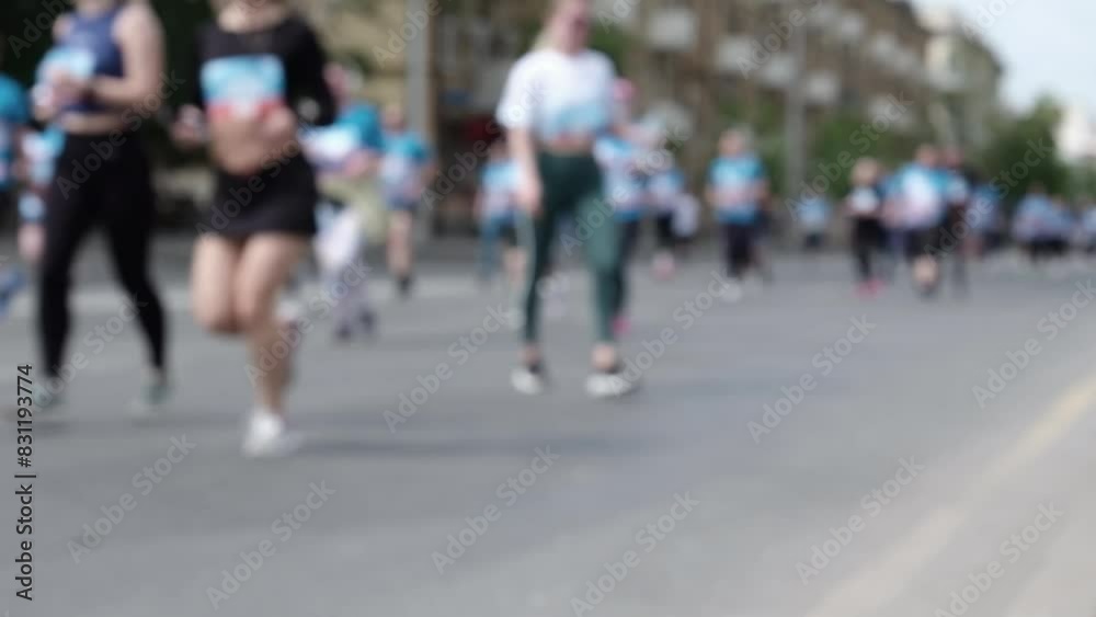 Urban marathon runners on the street in the city. Healthy lifestyle concept. Urban marathon runners on the street in the city. Healthy lifestyle concept.