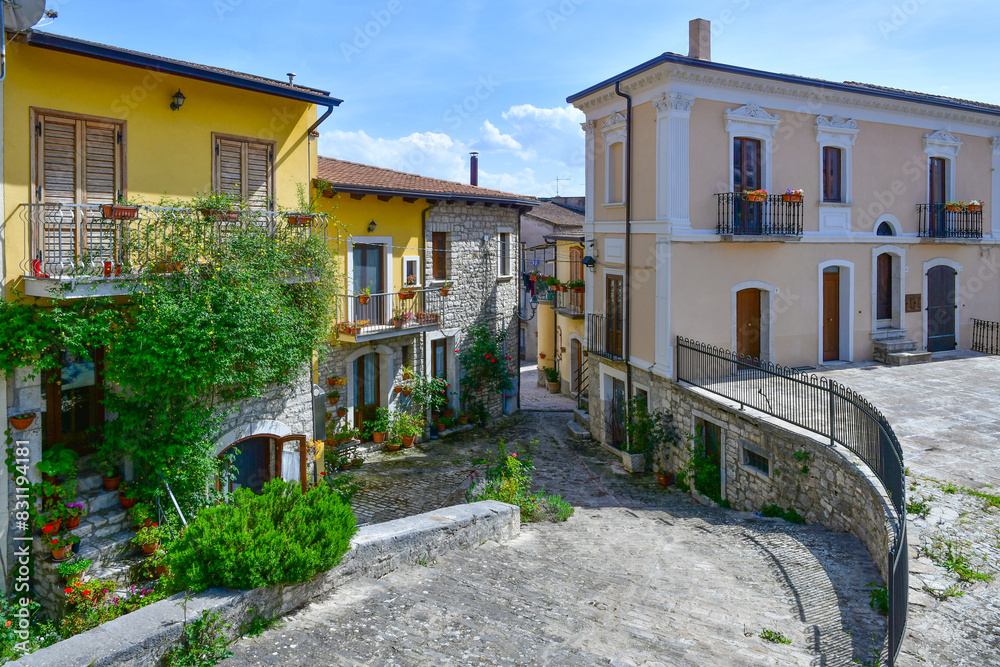 Fototapeta premium A narrow street with old houses in Pietrelcina, a medieval town in Campania, Italy.