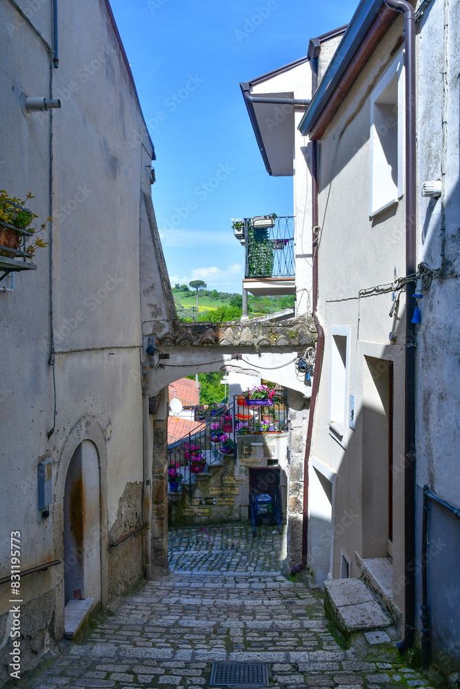 Fototapeta premium A narrow street with old houses in Pietrelcina, a medieval town in Campania, Italy.