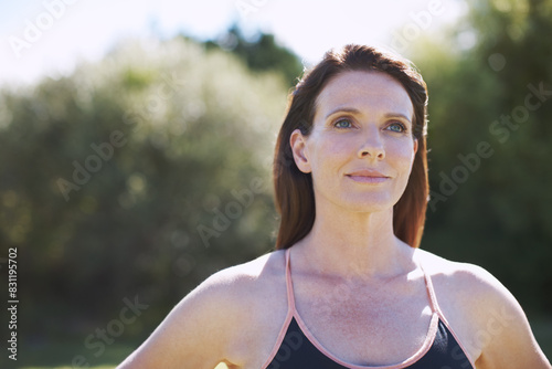 Woman, thinking and outdoor for peace, fitness and wellness in summer with calm mind or reflection. Girl, vision and exercise in nature or park for mental health, freedom and inspiration in morning