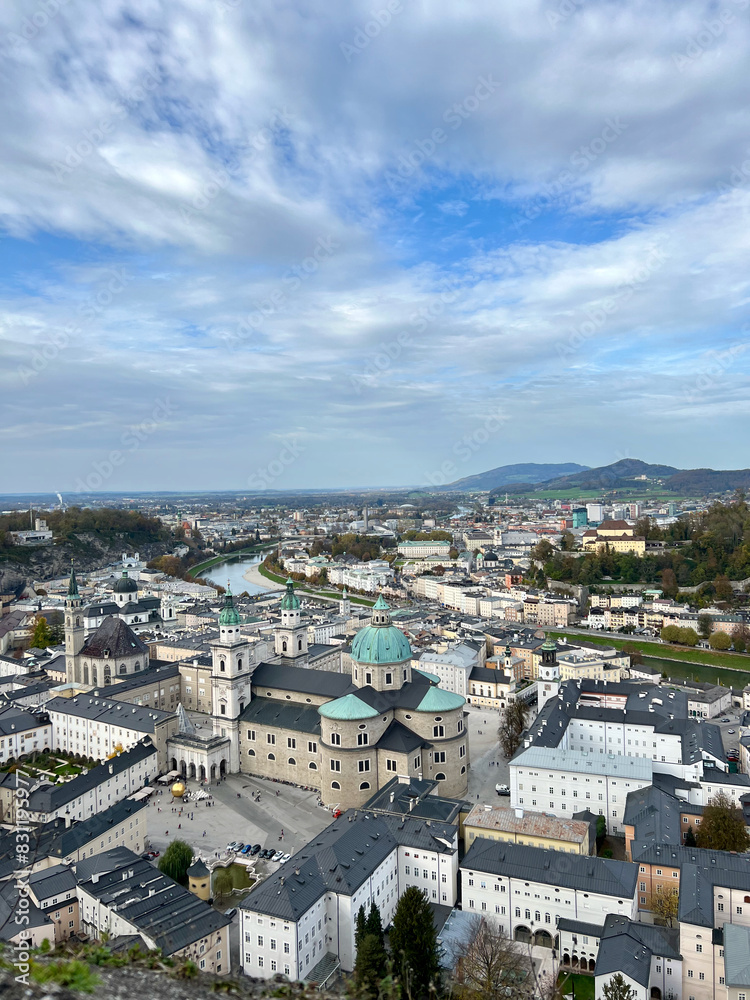 Fototapeta premium Stunning view of Salzburg city from the top of Fortress Hohensalzburg. The panoramic vista captures the historic architecture and scenic beauty of the city.
