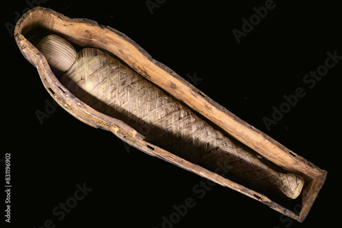 ancient Egyptian mummy in a museum on a dark background