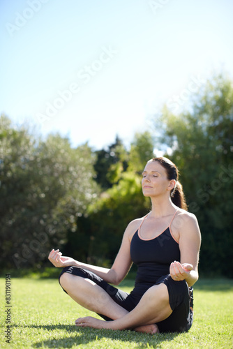 Woman, exercise or yoga outdoor in backyard for wellness, peace and health training in tree pose for balance. Female person, active and calm outside for pilates, relax or vrikshasana practice