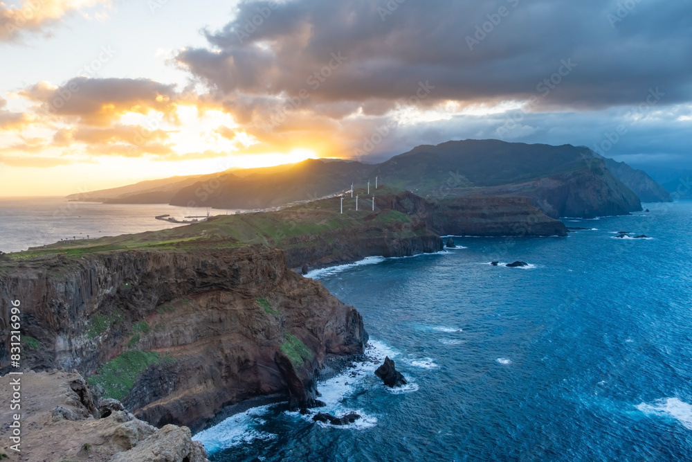Sunset On Ponta de Sao Lourenco Madeira Portugal. Scenic mountain view of green landscape, cliffs and Atlantic Ocean. Travel background Sunset On Ponta de Sao Lourenco Madeira Portugal. Scenic mountain view of green landscape, cliffs and Atlantic Ocean. Travel background