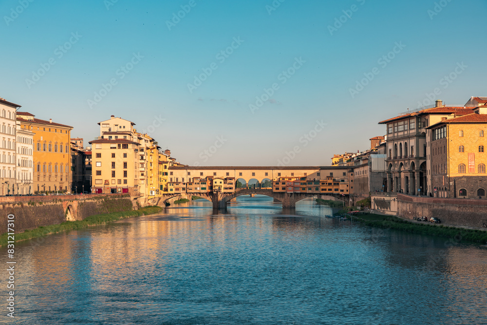 Fototapeta premium View on Ponte Vecchio Bridge in Florence during sunrise in the summertime with copy space