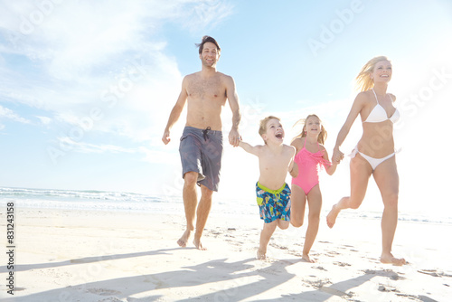 Love, sky and summer with family on beach, running together in summer for bonding or fun. Happy, nature or smile with mother, father and children on sand by ocean or sea for holiday and vacation