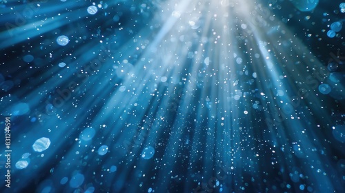 Enchanting visual of blue glitter particles falling in delicate light rays, forming a mesmerizing loop