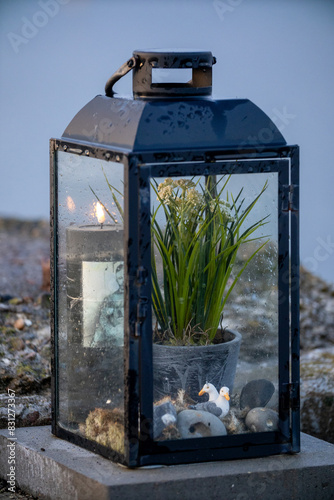 Closeup of Lantern with flowers inside and a candle