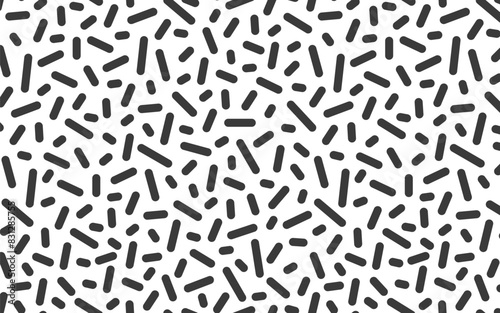 Abstract seamless pattern in memphis style. Black sticks on a white background.