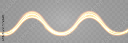 Light wave of shiny gold lines.Gold color glowing design element.Wavy bright stripes.	
 photo