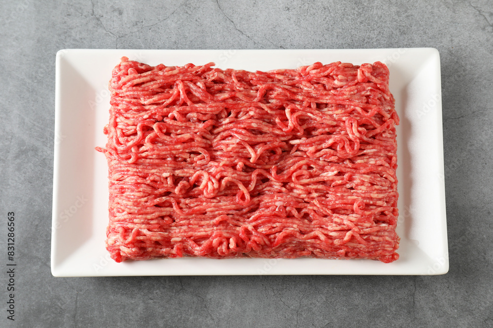 Raw ground meat on grey table, top view Raw ground meat on grey table, top view