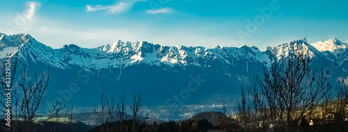 Alpine spring view with the famous Nordkette mountains at Innsbruck, Tyrol, Austria photo