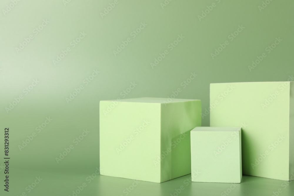 Presentation of product. Podiums and shadows on green background. Space for text Presentation of product. Podiums and shadows on green background. Space for text