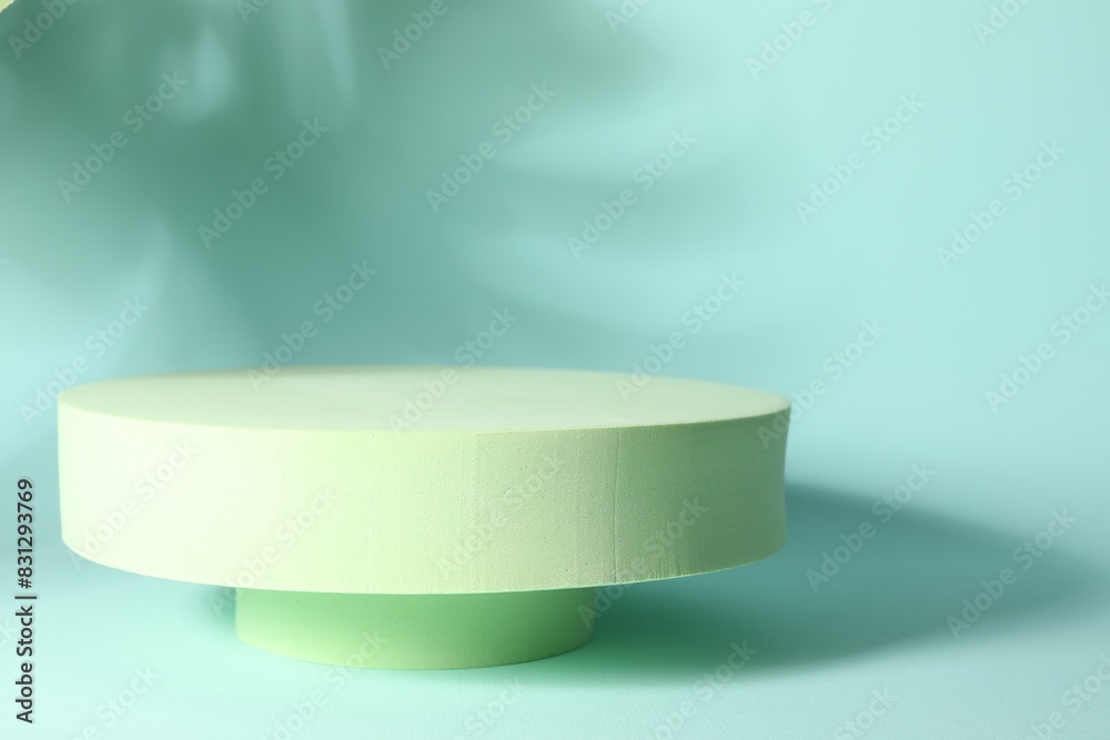 Presentation of product. Podiums and shadows on turquoise background. Space for text Presentation of product. Podiums and shadows on turquoise background. Space for text