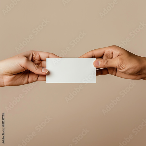 A blank business card mockup is passed from one hand to another
