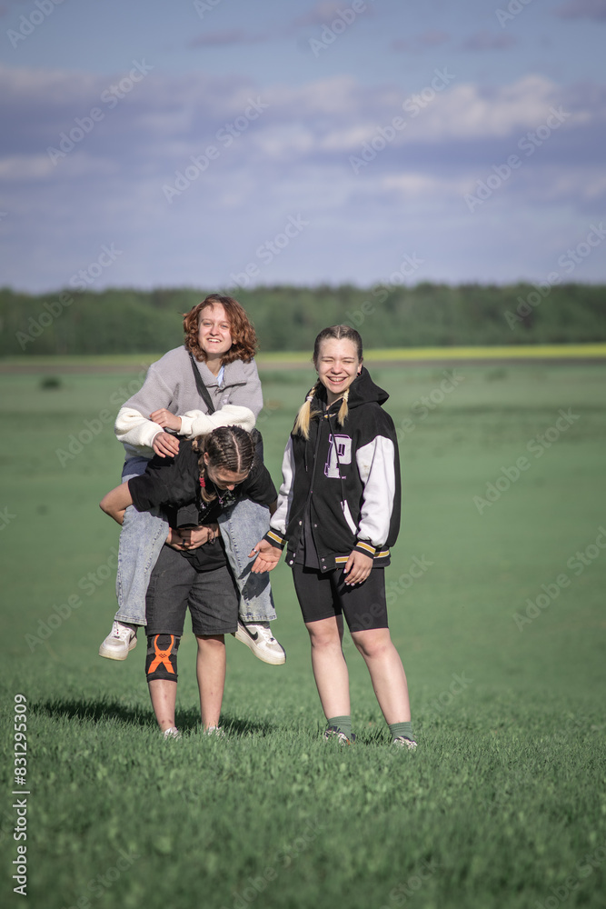 Three beautiful young girls friends on nature. Three beautiful young girls friends on nature.