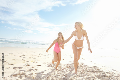 Happy  woman and kid at beach with running for summer adventure  bonding and vacation in sunshine. Sea  nature and mom with girl on sand by ocean for holiday  travel and weekend trip in California