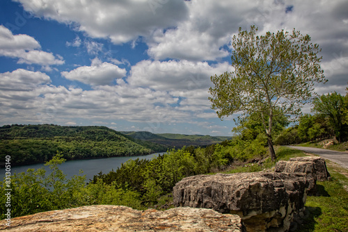 Overlook at Table Rock Lake, Holiday Island, Arkansas. Image contains large boulders, trees, mountains, water. © Sharlotte