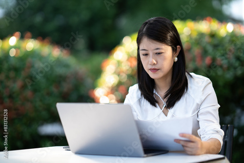 businesswoman working on laptop © zhu difeng