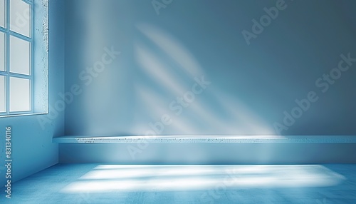 Product presentation with a minimalistic, simple background. Light blue wall adorned with shadows and light streaming in from windows. Tranquil, understated ambiance. Clean, uncluttered aesthetic. 