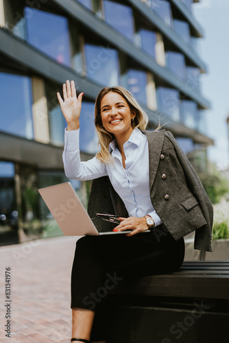Professional woman waving c...