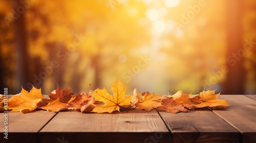 Empty wooden board top with a blurred background for autumn leaves