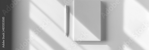 Simple notepad with white paper  placed on a white background  with natural shadows that accentuate its texture and thickness. Empty notebook ready to be filled. AI generated