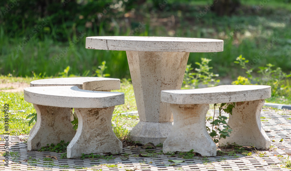 Marble table with chairs in the park Marble table with chairs in the park