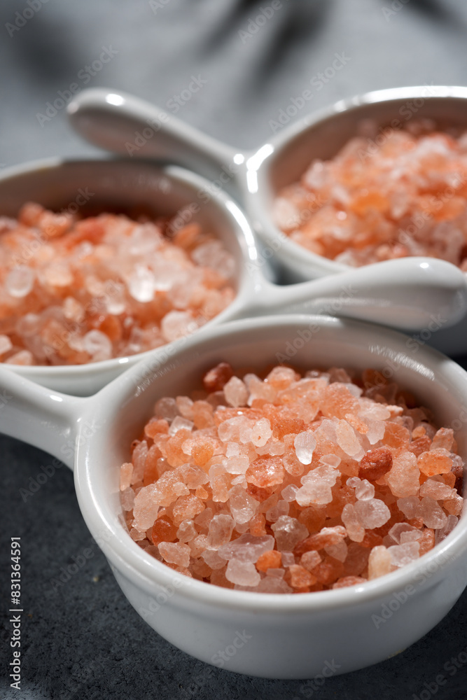 Himalayan pink salt in three small ceramic cups Himalayan pink salt in three small ceramic cups