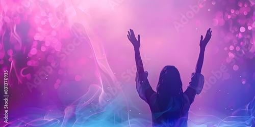 A striking photograph capturing the essence of worship, with a woman's hands raised against a dynamic purple and pink background. photo