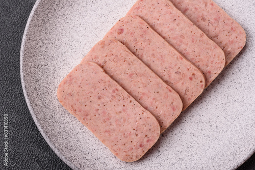 Delicious canned pink ham with salt, spices and herbs