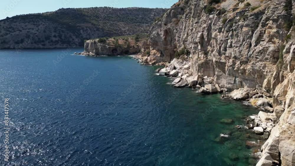 Aerial view of the cliffs beneath the monastery on Thasos, Greece over the Aegean sea Aerial view of the cliffs beneath the monastery on Thasos, Greece over the Aegean sea