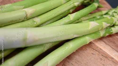 fresh green asparagus in wooden background. healthy food concept