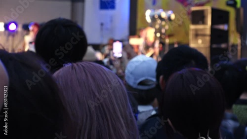 Wallpaper Mural JAPAN : Back shot of crowd of people at the outdoor music festival. Audience enjoying the live music, dancing and taking videos of the musician on the stage. Entertainment and event concept video. Torontodigital.ca