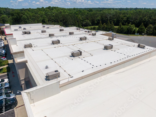 Drone Images of Commercial Roofs Featuring TPO and Asphalt Shingles: Midday, Sunny, No People photo