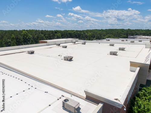 Drone Images of Commercial Roofs Featuring TPO and Asphalt Shingles: Midday, Sunny, No People