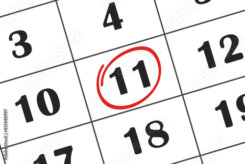 Date on the calendar, 11, the eleventh number circled in red marker. Planning. Save the date written on the calendar