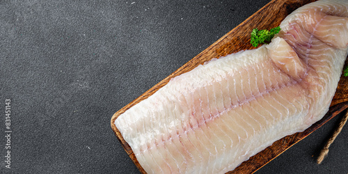 sea bass fresh raw fish fillet giant and filleting grouper cooking appetizer meal food snack on the table copy space food background rustic top view  photo