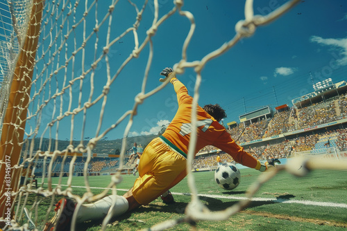 Football game. The goalkeeper hits the ball away from the goal. Olympic Games photo