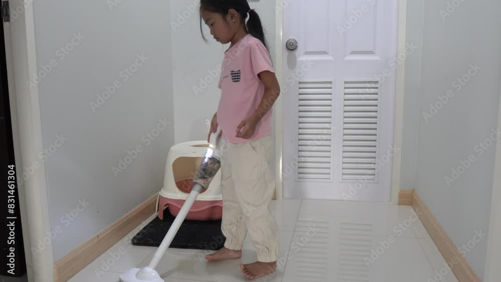 Asian girl cleaning cat litter box at home,maintaining cleanliness,pet care,hygiene in household,proper waste management,indoor cat habits,teaching responsibility,keeping home fresh,cleaning after pet