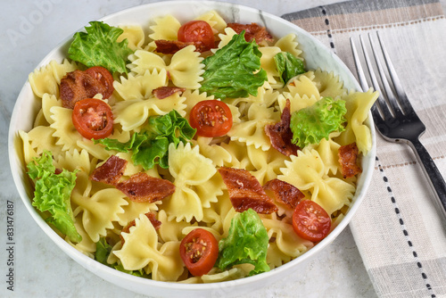 farfalle   pasta salad  with tomatoes, lettuce and bacon