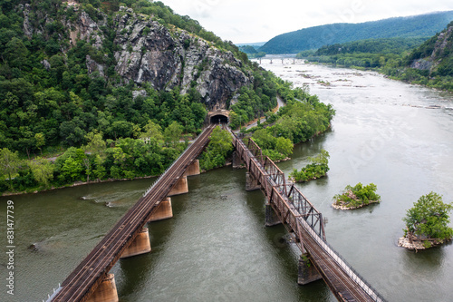 Aerial View of A Rail Bridge in Harpers Ferry West Virginia Leading to a Tunnel in A Mountain