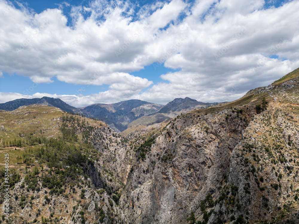 Top View Aerial Photo from Drone of Canyon Range in Arid Wilderness Landscape. Top View Aerial Photo from Drone of Canyon Range in Arid Wilderness Landscape.