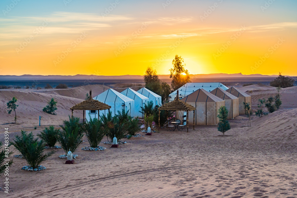 Luxury tent camp at Erg Chebbi Sahara desert at sunrise near Merzouga town, Morocco, North Africa