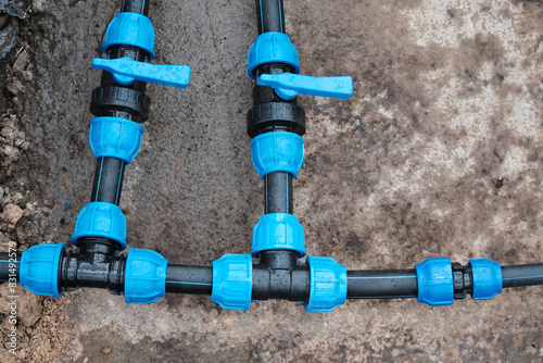Fragment of a water supply system made of HDPE pipes, installation of automatic watering