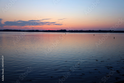 Fototapeta Naklejka Na Ścianę i Meble -  View of the sunset over the sea in summer 